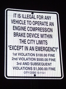 It is illegal for any vehicle to operate an engine compression brake device with in the city limits "Except in an emergency"...